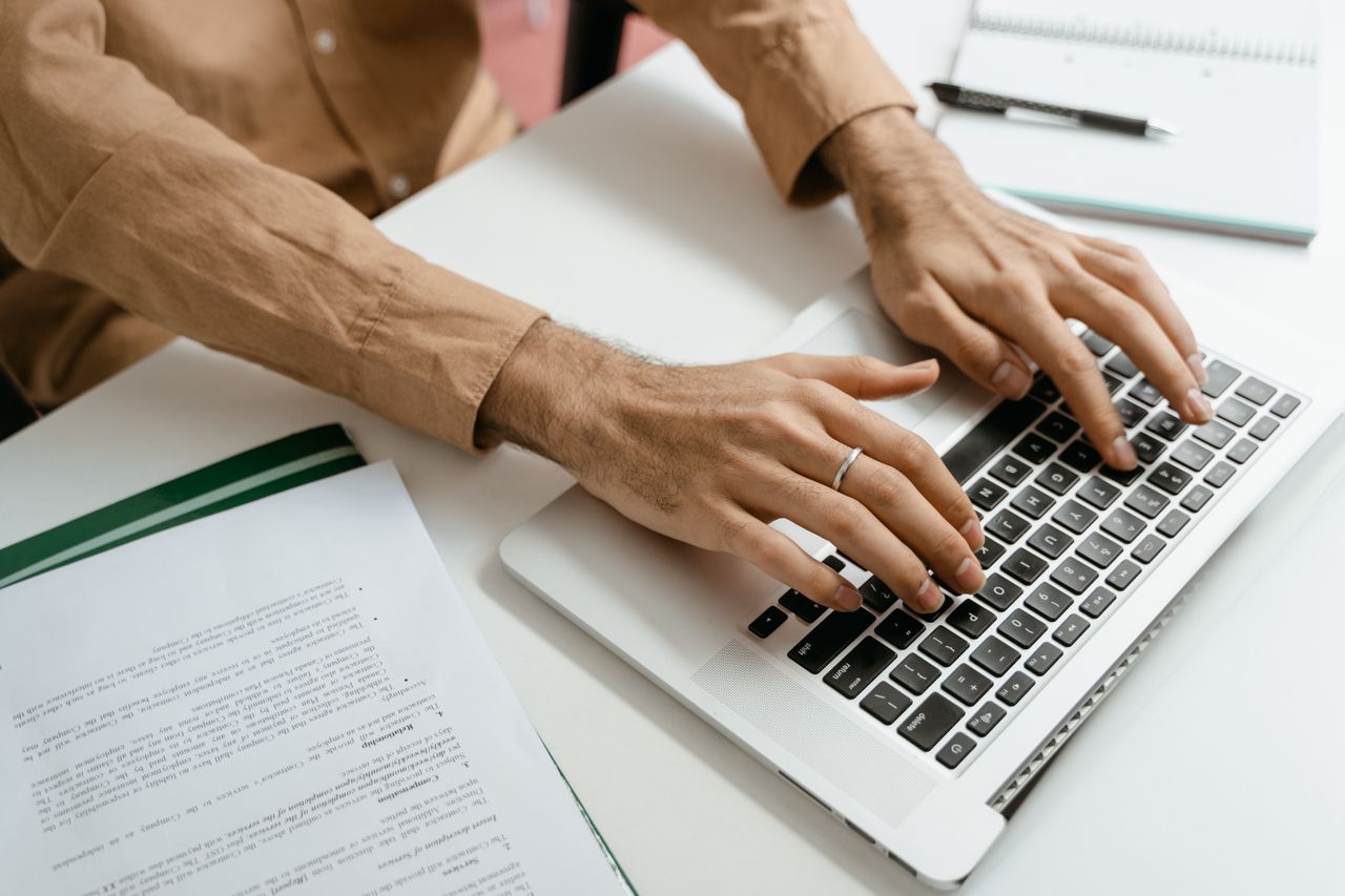 Employee organising digital business files on a computer